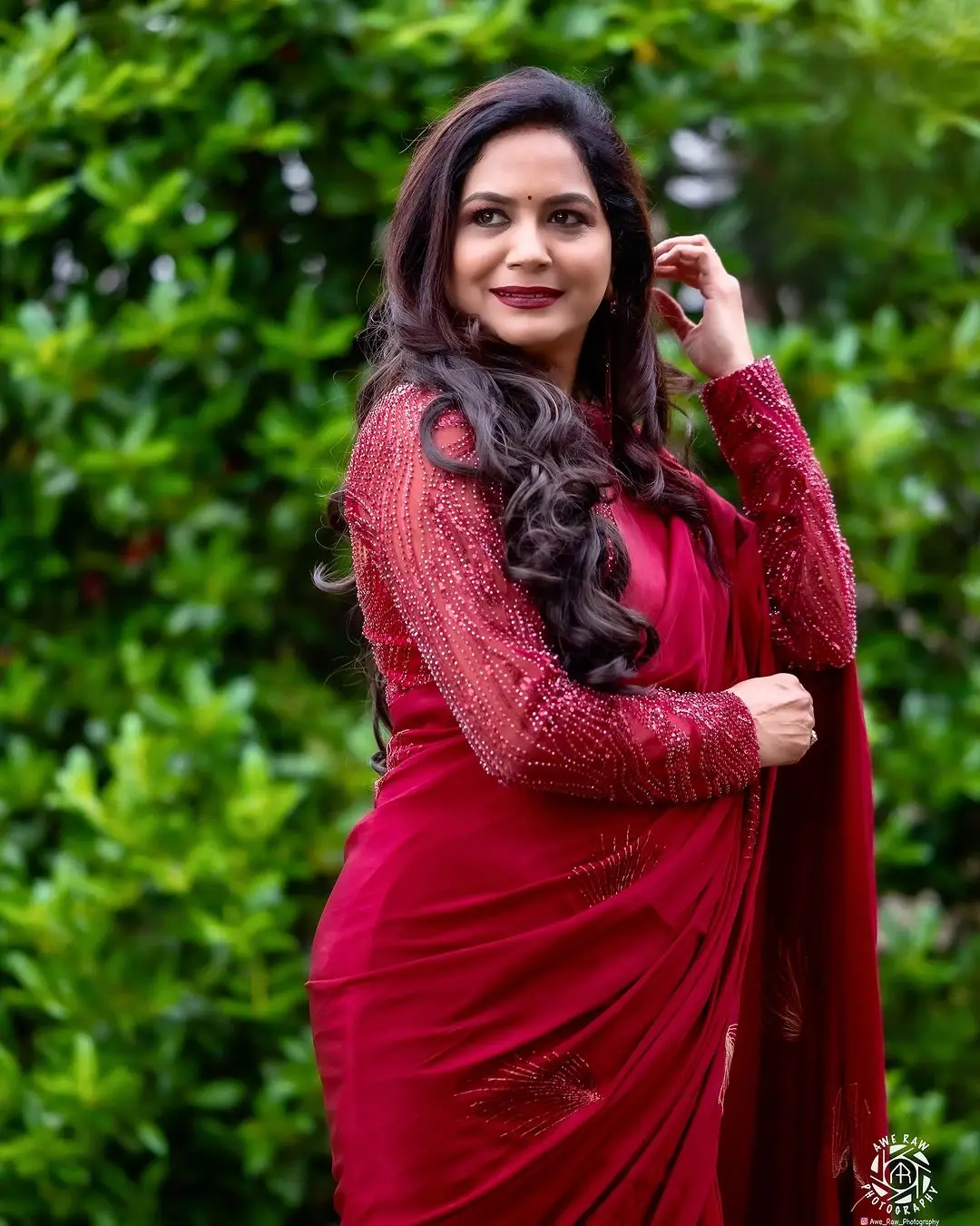 Telugu Singer Sunitha Stills In Maroon Saree Blouse